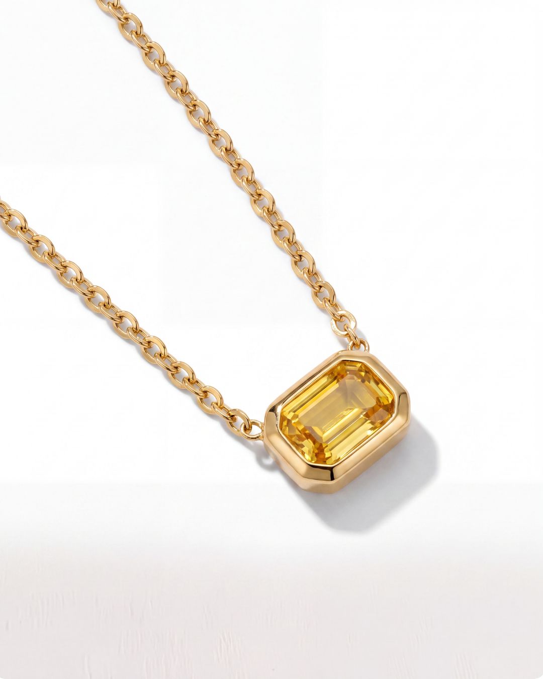Ciel Pendant worn layered with a delicate gold chain
