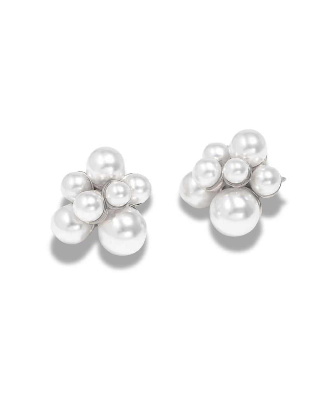 The Pearl Bloom Studs laid flat against a plain background
