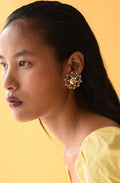 SETTING SUN: Round, mystical and grand Swarovski ear studs